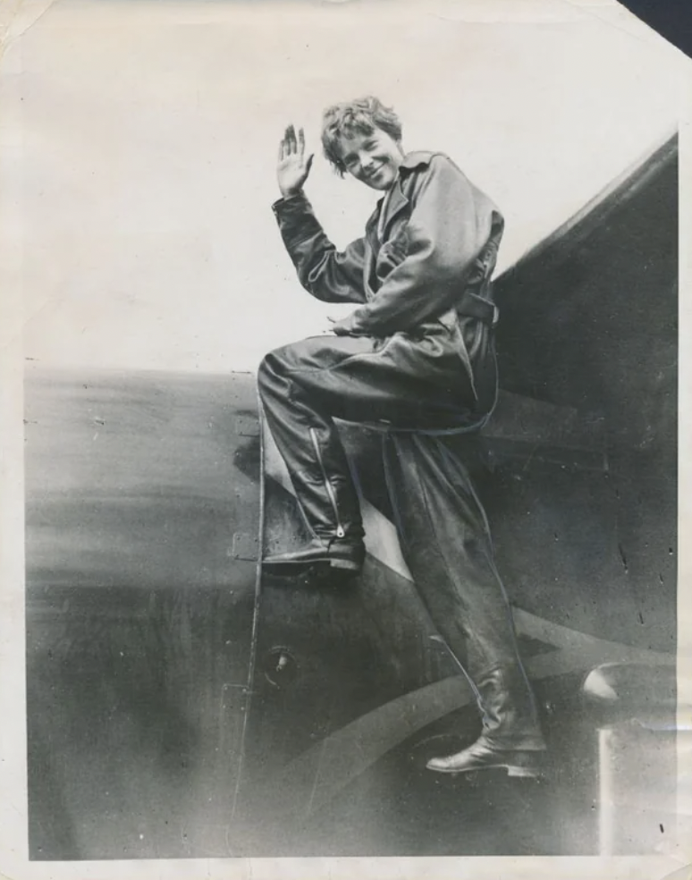 Amelia Earhart with her plane, 1932.
