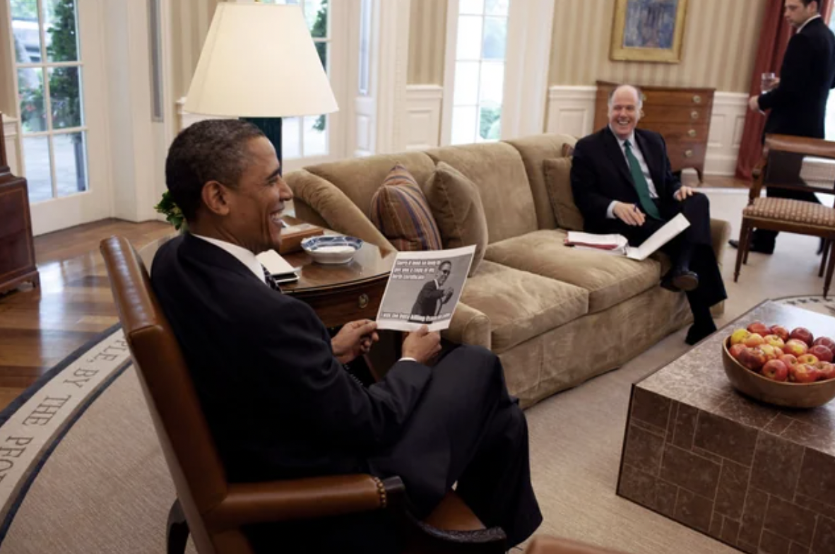 Barack Obama laughing at a meme of himself the day he ordered the assassination of Osama Bin Laden.