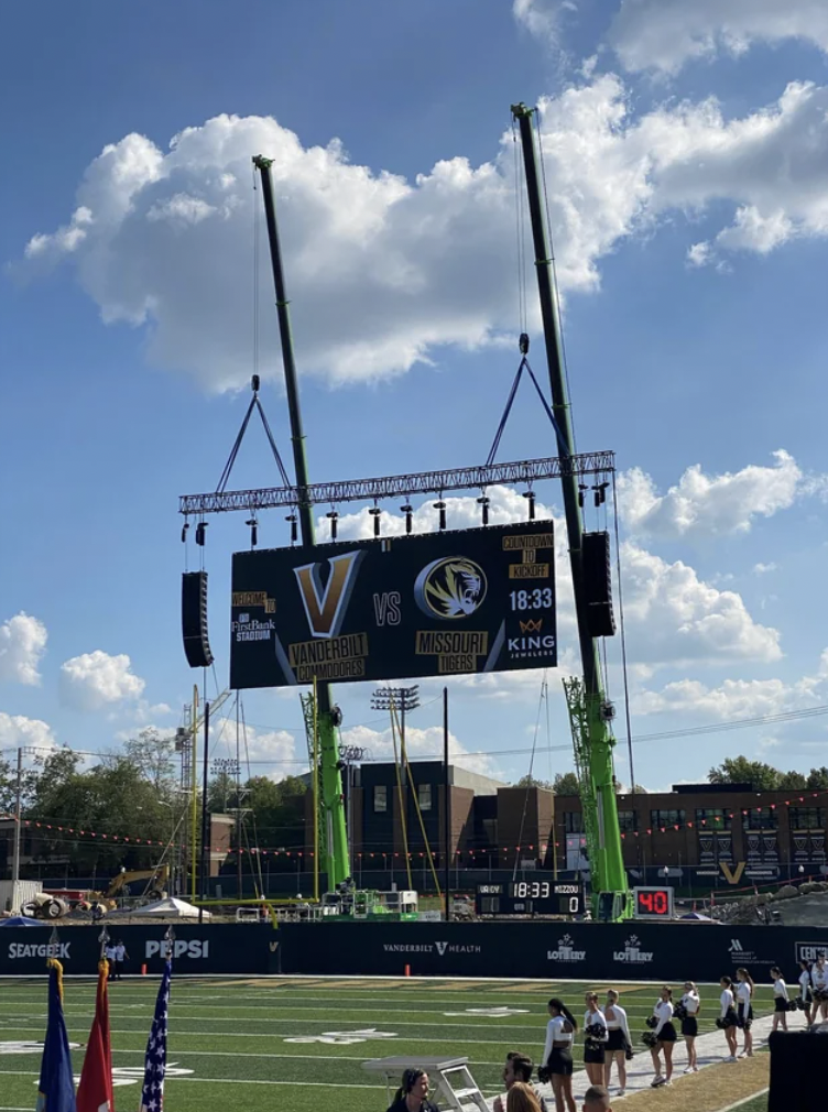 Vanderbilt's football stadium renovation did not get completed before the season started, so the jumbotron is being anchored down by cranes.