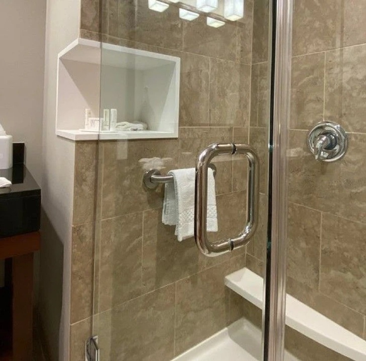 “This hotel I’m staying at has the shower shelf accessible from both inside as well as outside.”