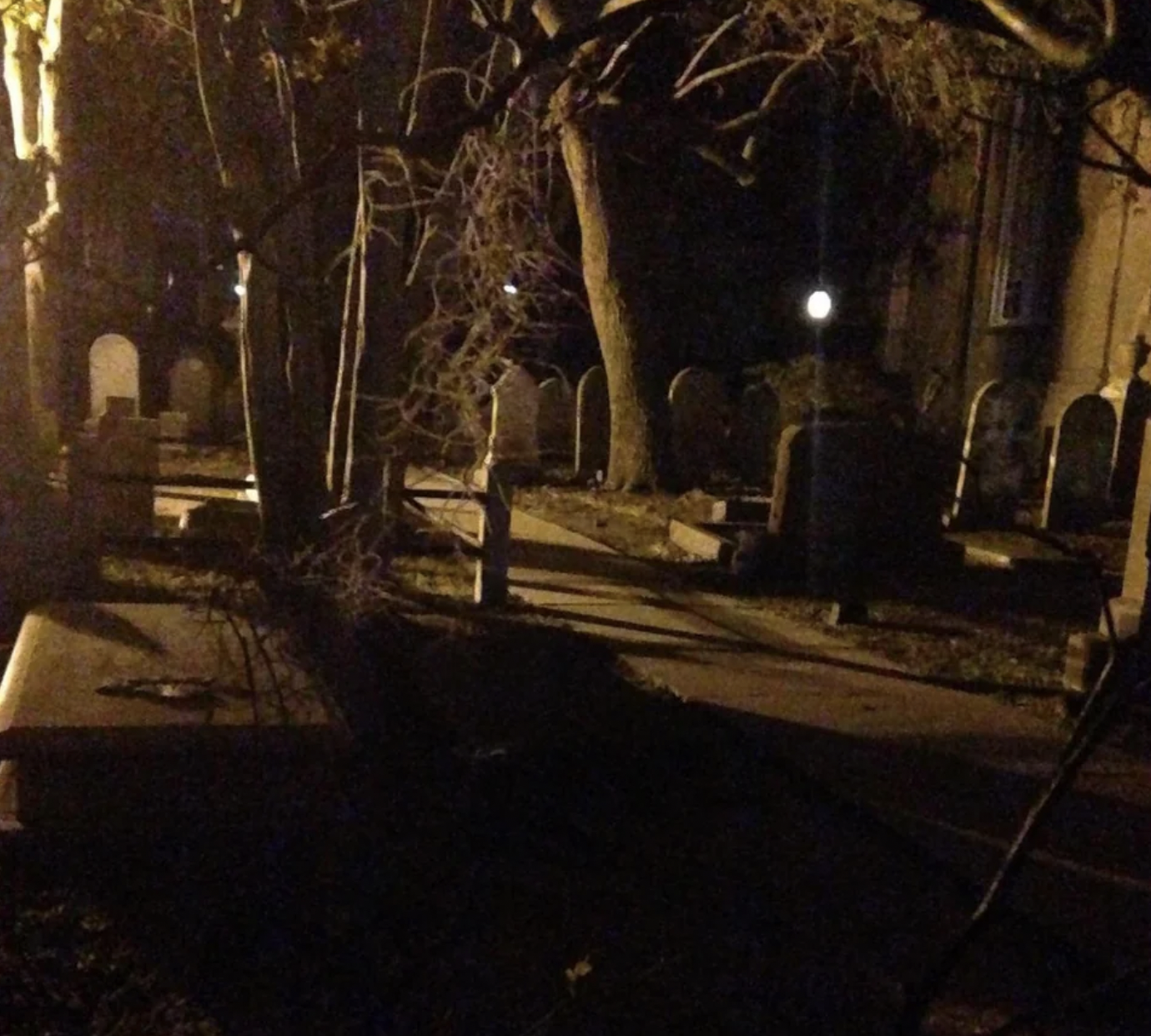 Taken in an old historic cemetery next to a church, you can see a face on the tombstone on the far right of the photo. Never noticed it until my friend was looking at the pictures I took from my trip and pointed it out to me!
