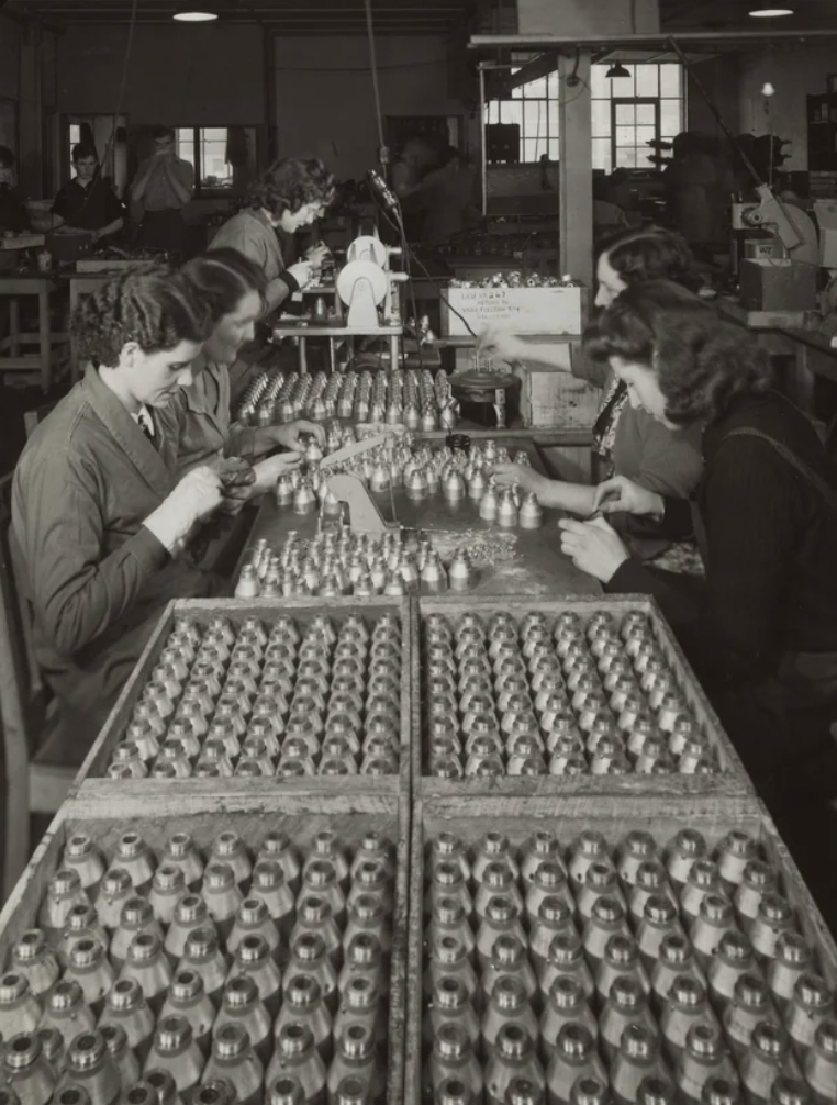 Women assembling mortar bombs at the Swan Electric Company in Wellington, New Zealand. Circa 1939-1945.