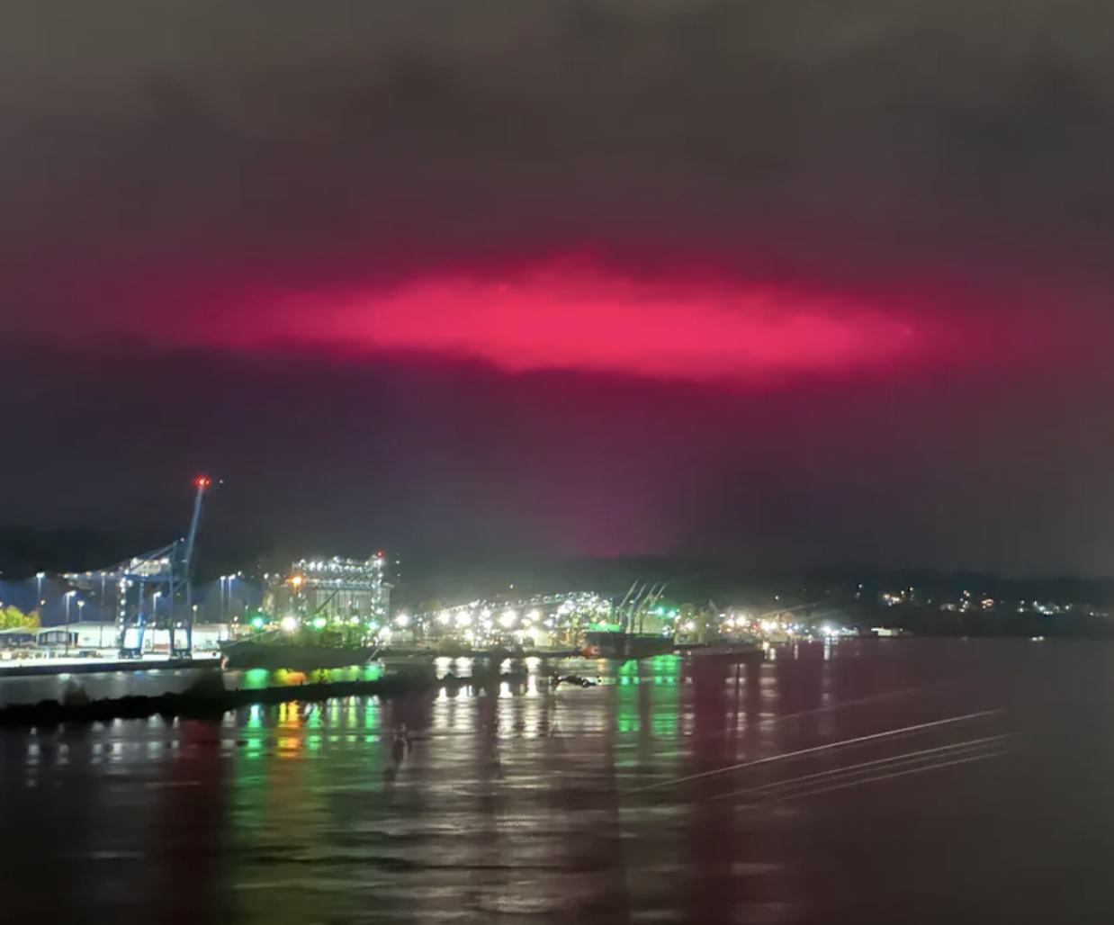 Pink lights in the sky from cannabis greenhouses.