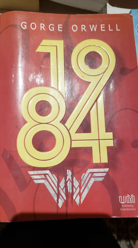 A copy of George Orwell's 1984 that has Wonder Woman 1984 on the cover.