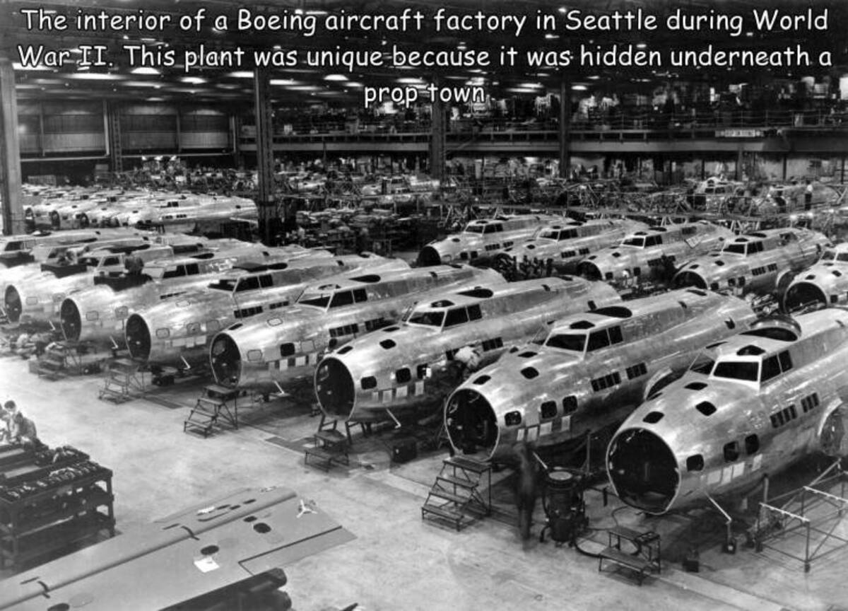 boeing plant - The interior of a Boeing aircraft factory in Seattle during World War Ii. This plant was unique because it was hidden underneath a prop town