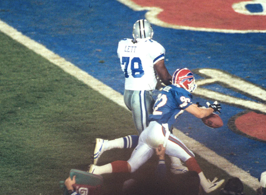 Leon Lett celebrated his fumble recovery touchdown a little too early, and Bills player Don Beebe knocked the ball out of his hands before he could score. 