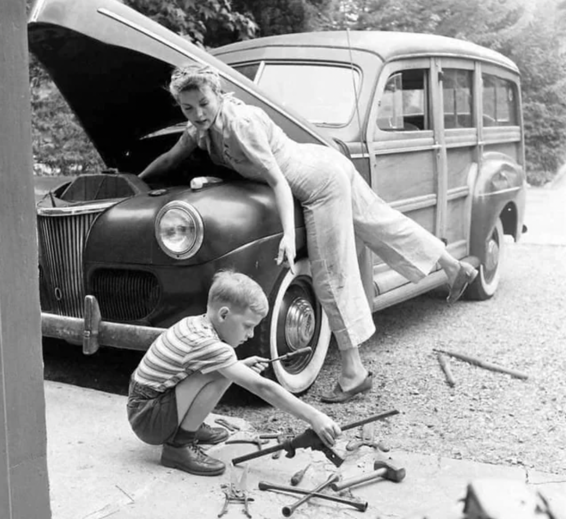 vintage woman car fixing