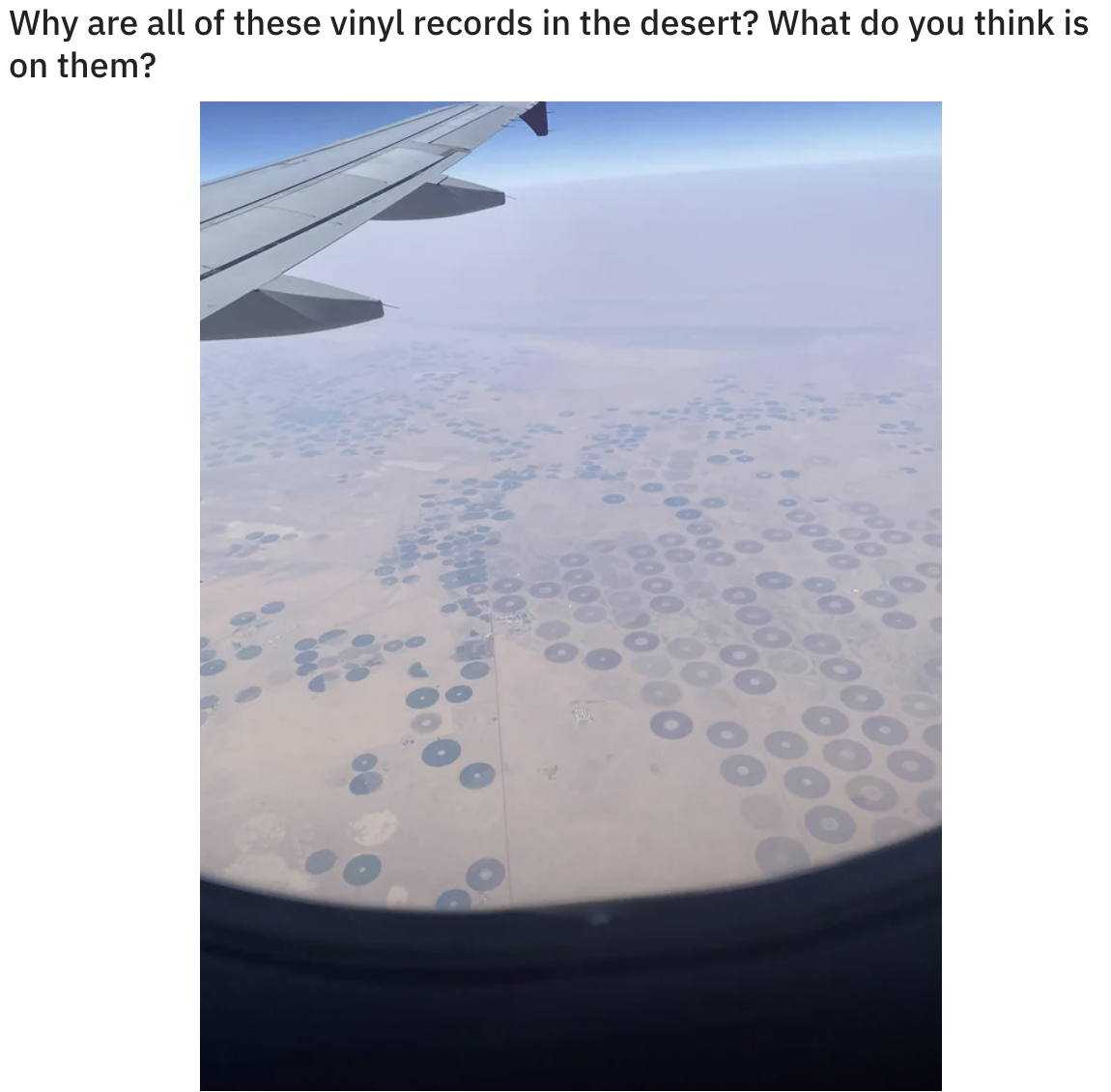 sky - Why are all of these vinyl records in the desert? What do you think is on them? 1000
