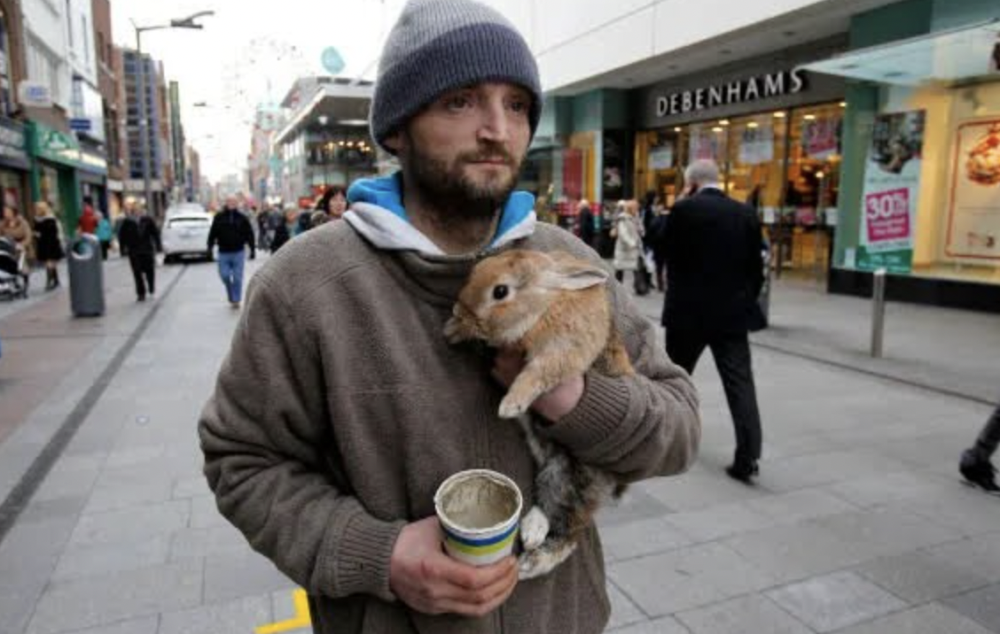 This Homeless man's rabbit was thrown over a bridge by a passerby and he immediately jumped into the river to save her. He won an award, was given animal food and a job, and the passerby was charged with animal cruelty.