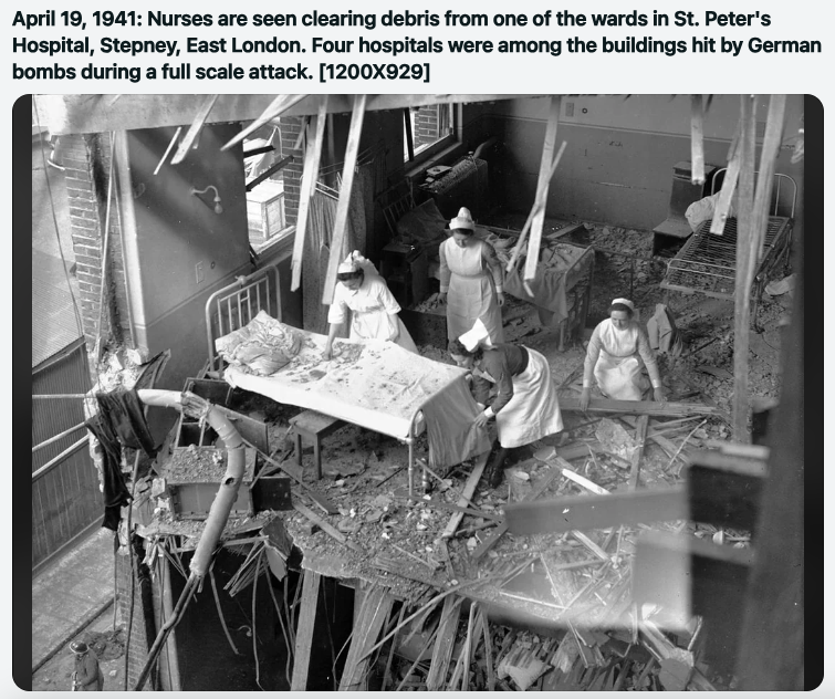 Nurses are seen clearing debris from one of the wards in St. Peter's Hospital, Stepney, East London. Four hospitals were among the buildings hit by German bombs during a full scale attack. 1200X929