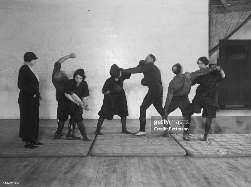 [March 22nd, 1924] "New York: Policewomen practice Jiu Jitsu. Photo shows Mrs. Hamilton, who is in charge of the class, giving instructions in how to handle the women annoyers."