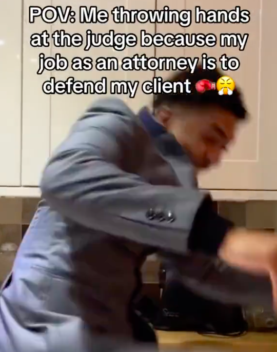 sitting - Pov Me throwing hands at the judge because my job as an attorney is to defend my client