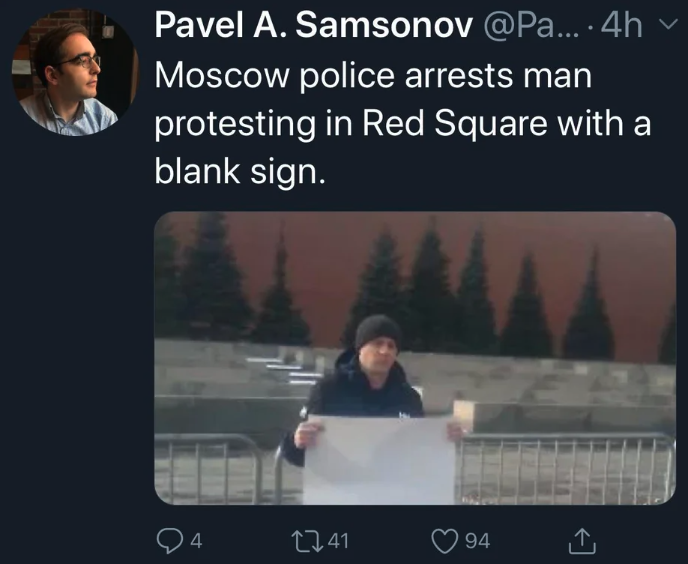 photo caption - Pavel A. Samsonov ....4h Moscow police arrests man protesting in Red Square with a blank sign. 4 741 94