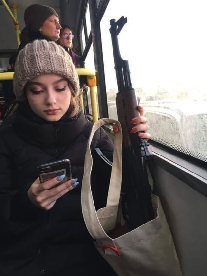 girl with ak on bus