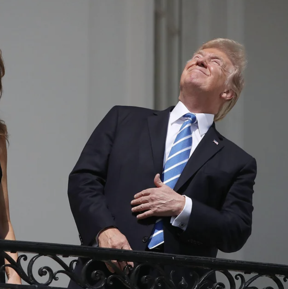 trump looking at eclipse - No