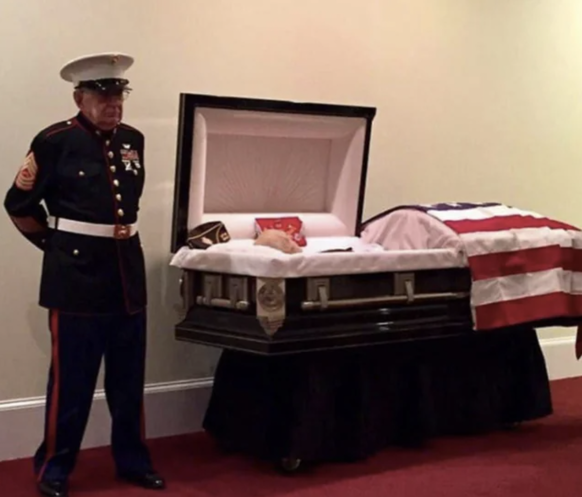 marine stands guard at funeral