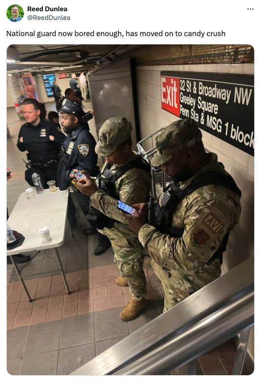soldier - Reed Dunlea National guard now bored enough, has moved on to candy crush S&Broadway Nw Greeley Square Penn Sta& Msg 1 block Avi