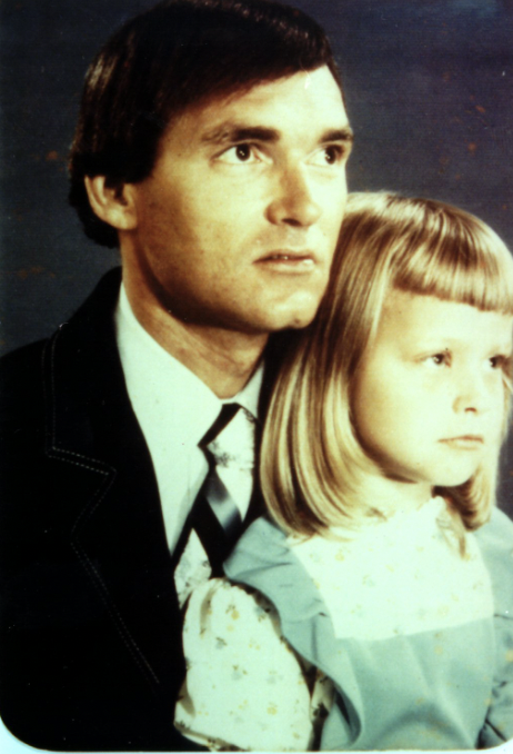 A father and his daughter posing for a family photo. In actuality, the little girl is Franklin Delano Floyd's stepdaughter, Suzanne Marie Sevakis, who he'd kidnapped around 1974, when Suzanne was under 10 years old. He would go on to raise her as his daughter, putting her through highschool under several pseudonyms, then have a son with her in 19881 and marry her in 1989, under the name Tonya Hughes. By 1990, Tonya/Suzanne had decided to leave Floyd, and take her son, Michael, with her. In April of that year, she was found beaten and bruised on the side of a highway, and subsequently died in hospital. Michael went into foster care and was adopted by a loving family, only to be kidnapped by Floyd in 1994 and to never be seen again. Floyd was arrested in late 1994. The news about his late 2nd wife being his kidnapped step daughter didn't come out until 2014.