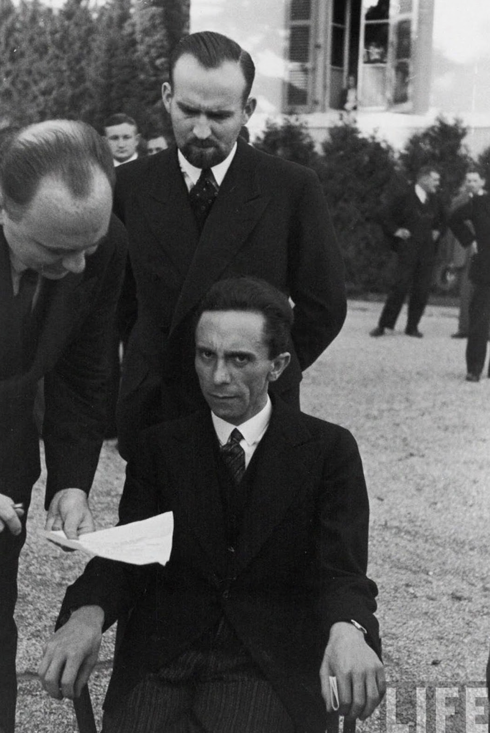 “Eyes of Hate,” a candid photograph of Goebbels after he finds out his photographer was Jewish, 1933. “He looked up at me with an expression full of hate. The result, however, was a much stronger photograph.” 