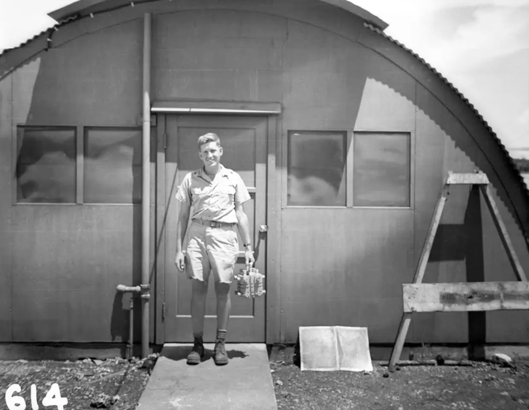 This Physicist, Harold Agnew, is holding the nuclear core of the Fat Man atomic bomb which was dropped on Nagasaki.
