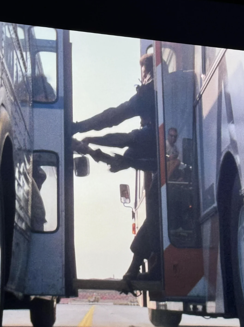 In “Speed,” this crew member is visible in a door reflection.