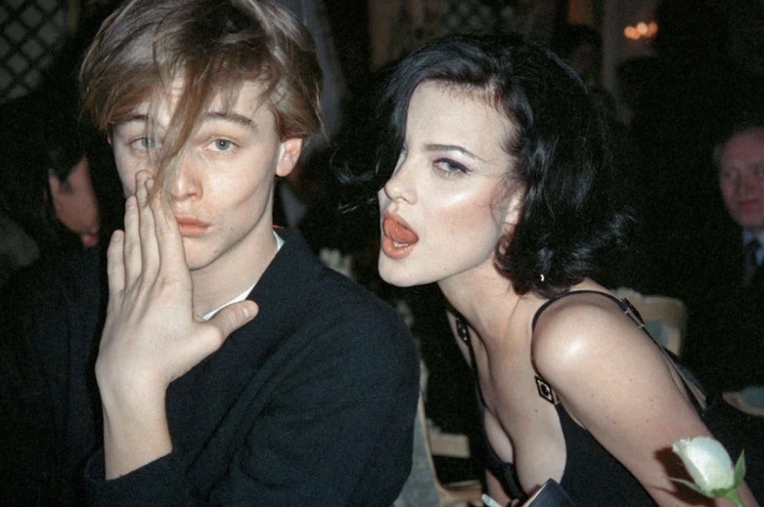 Leonardo DiCaprio and Shalom Harlow at a dinner party thrown by Gianni Versace, 1995.