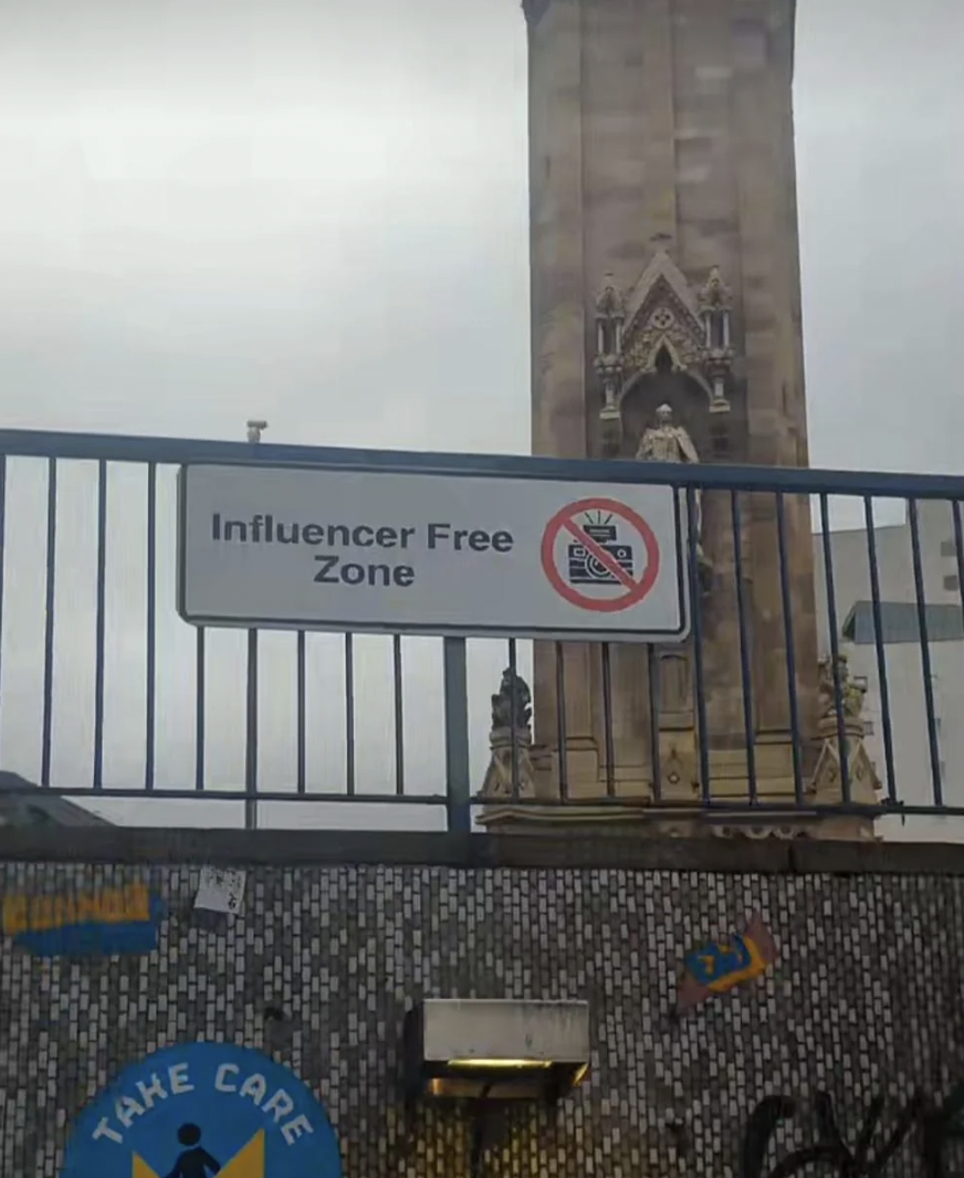 street sign - Take Influencer Free Zone Care