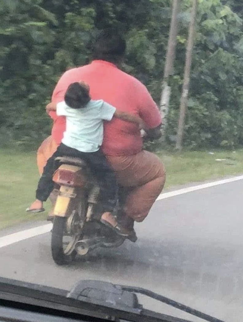 big guy riding small motorcycle