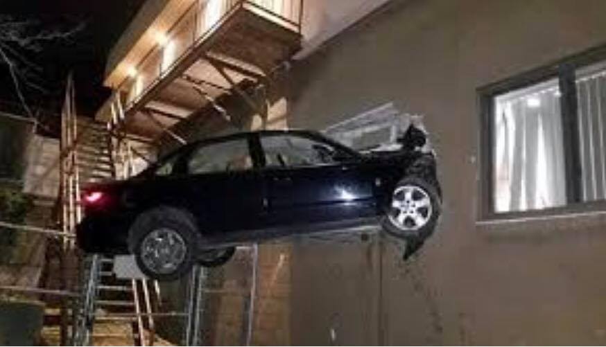 car crash into the side of a building