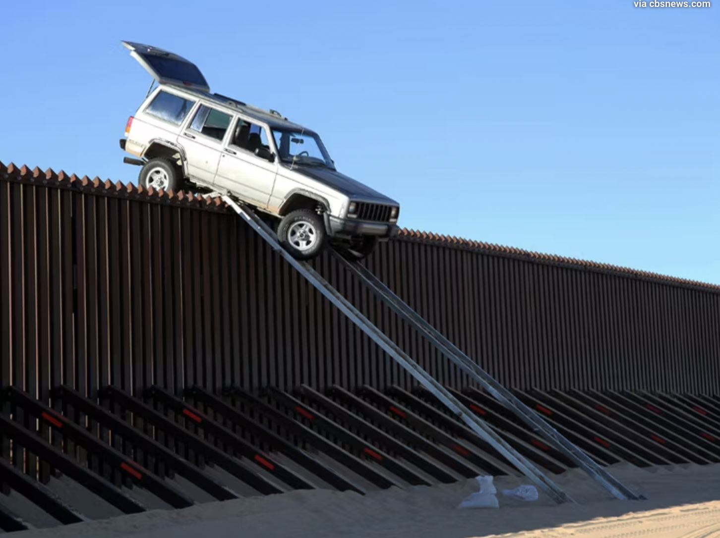 car stuck on border wall - via cbsnews.com