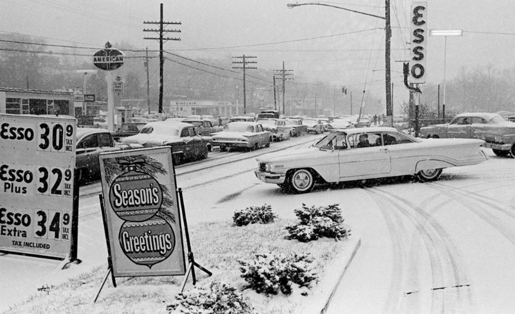 gas prices in 1960 - Esso 30% Esso 32 Plus Esso 34 Extra Tax Included Tax Day Seasons Greetings S S