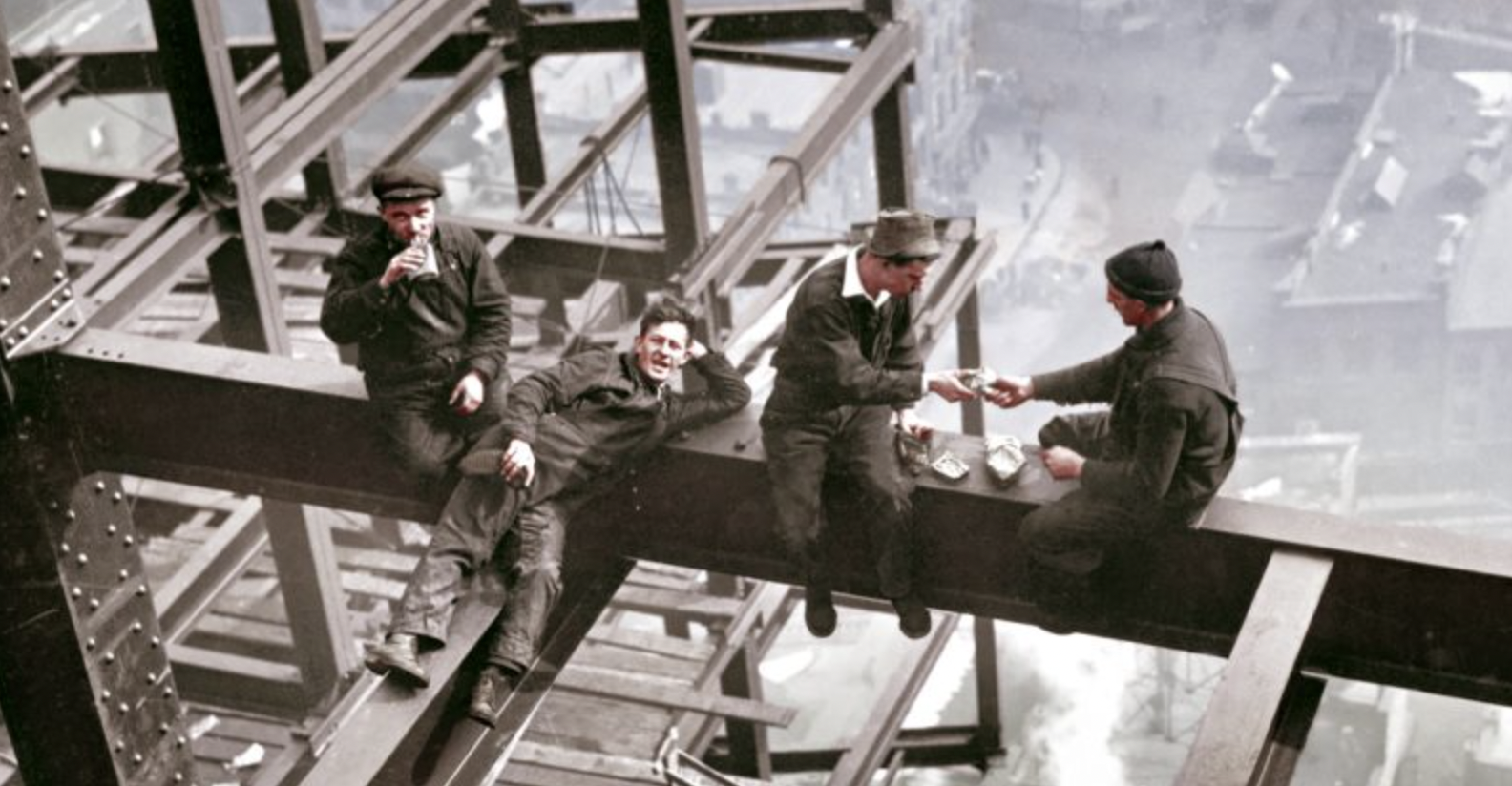 workers eating lunch on beam