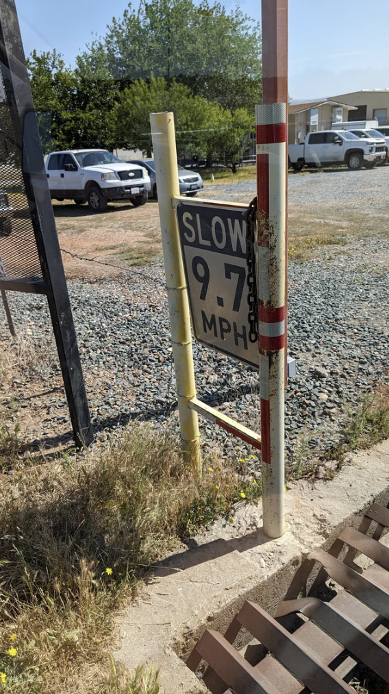 street sign - Slow 9.7 Mpho