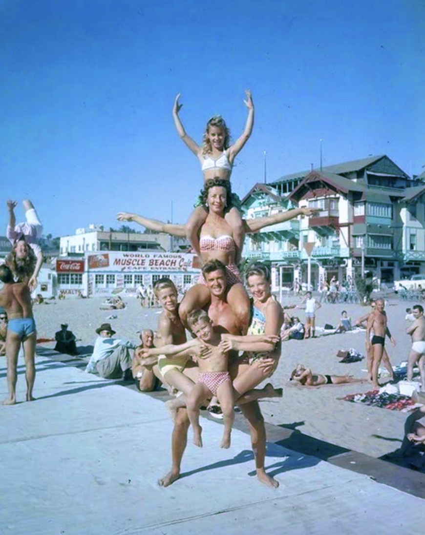 Fit family posing at Muscle Beach in California in the 1950's.