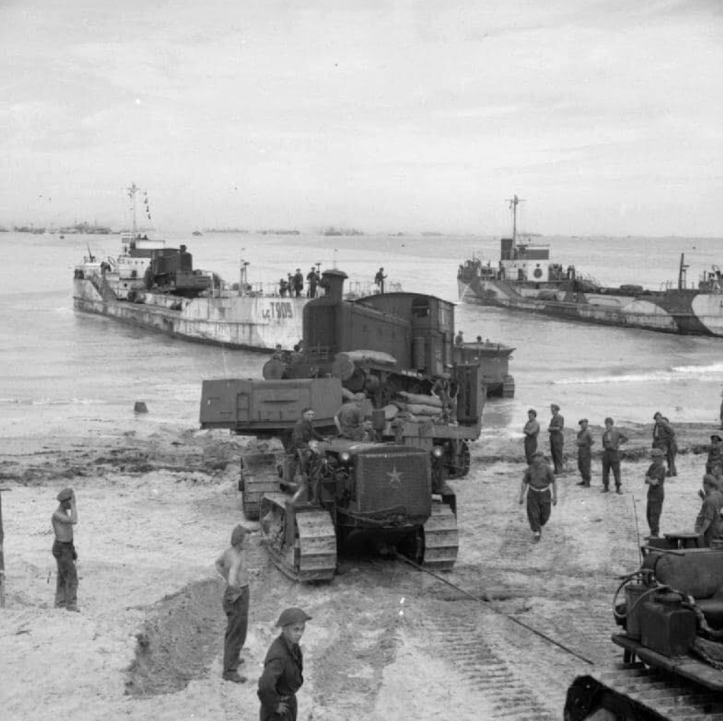 British War Department locomotive being unloaded at Normandy.