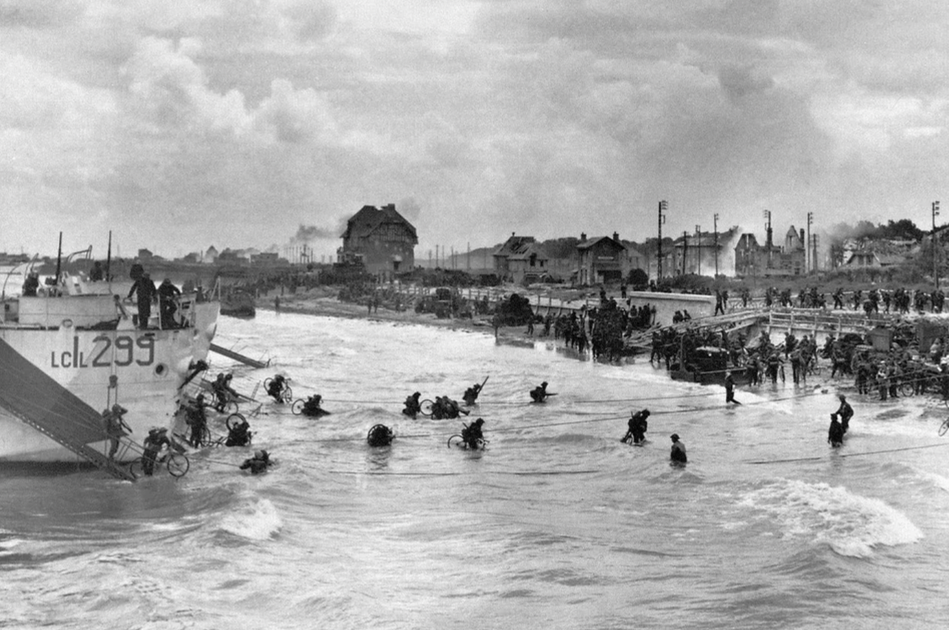Canadian soldiers from the 9th Brigade land with their bicycles at Juno Beach.