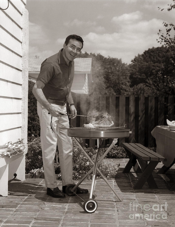 1960s man grilling - fineart america