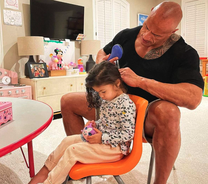 rock with his daughter