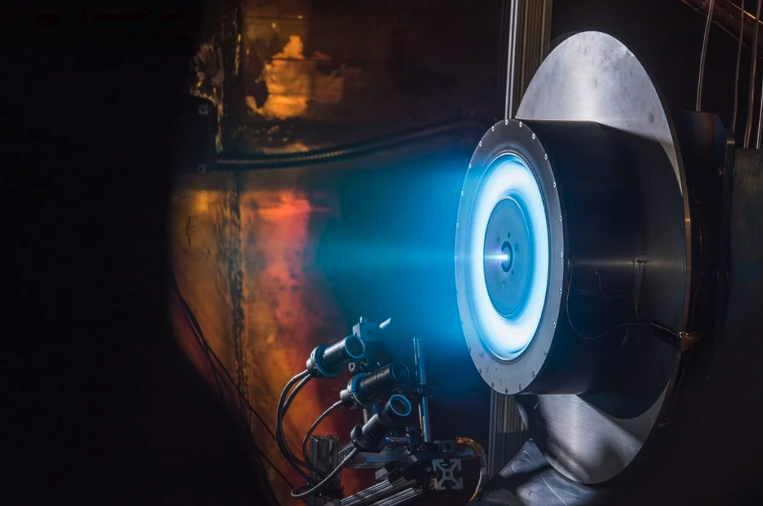 A NASA ion engine while under test at the Glenn Research Center. It can propel spacecrafts to speeds of up to 320,000 km per hour