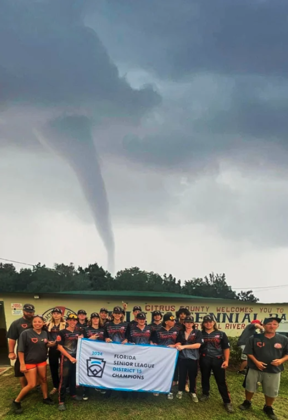 Little League Allstars won a District championship Sunday in Crystal River, Florida while a waterspout tornado formed in the distance.