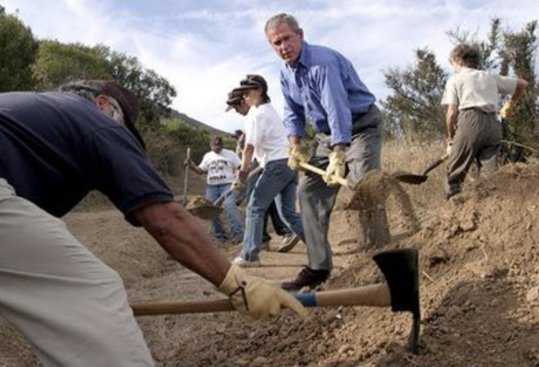 President George W. Bush lends a hand in repairing the Old Boney Trail at the Santa Monica Mountains National Recreation Area in Thousand Oaks, Calif., Aug. 15, 2003.