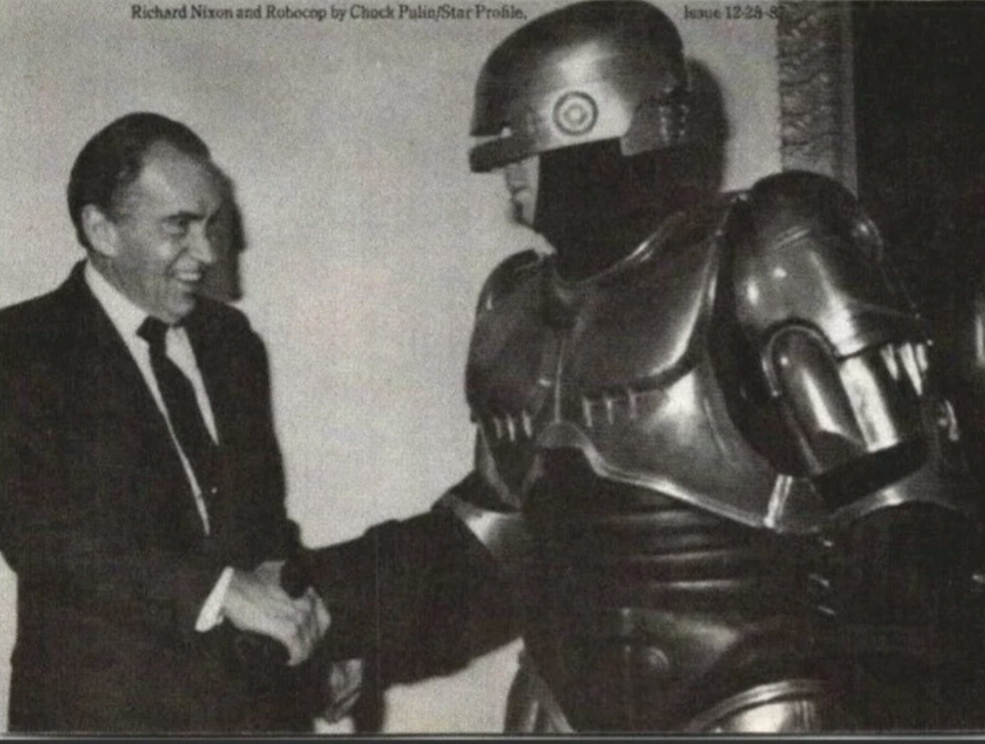 Richard M. Nixon is escorted by RoboCop at a national board meeting of the Boys Club of America. 1987.