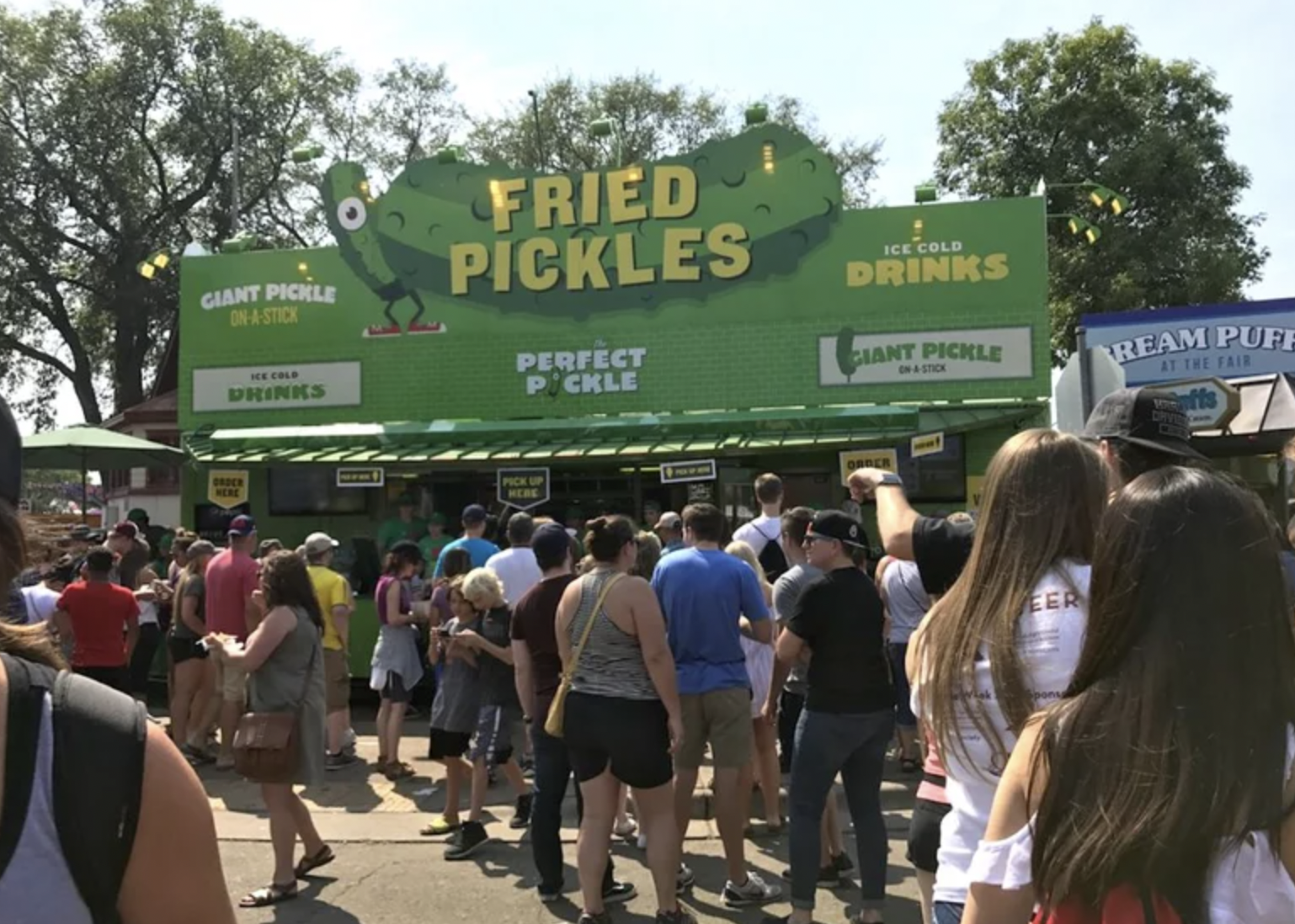 crowd - Giant Pickle OnA Stick Drinks Fried Pickles Perfect Pockle Ice Cold Drinks Ciant Pickle Am A Stron Ream Puff At The Fair Pick Up Eer