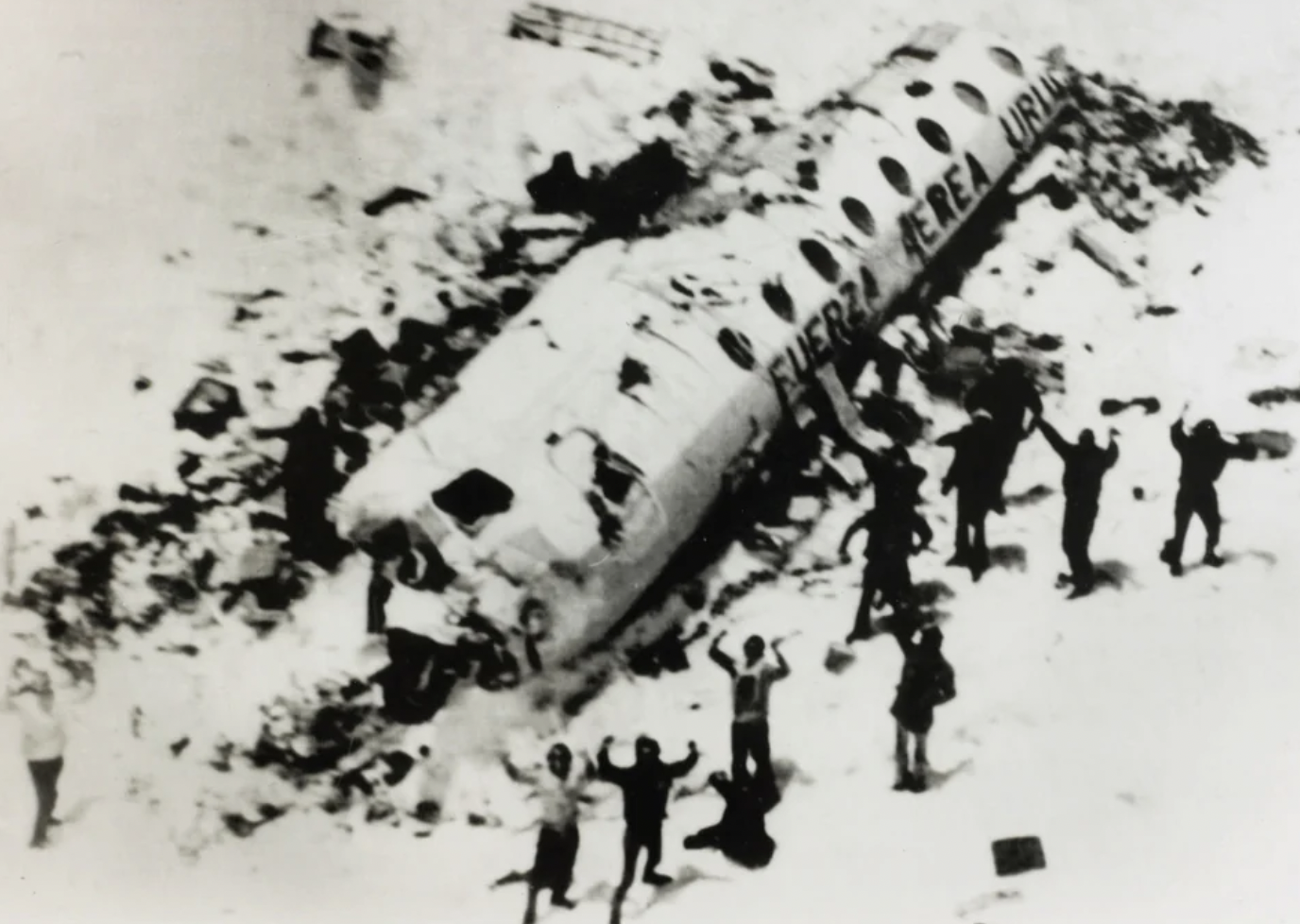 Survivors from the "Andes Flight Disaster" wait to be rescued. Of the initial 45 passengers and crew, only 16 survived. Chile/Argentina border, 1972.