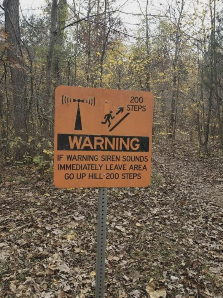 creepy sign - 1704111 T 200 Steps Warning If Warning Siren Sounds Immediately Leave Area Go Up Hill 200 Steps