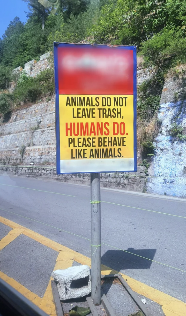 street sign - Animals Do Not Leave Trash, Humans Do. Please Behave Animals.
