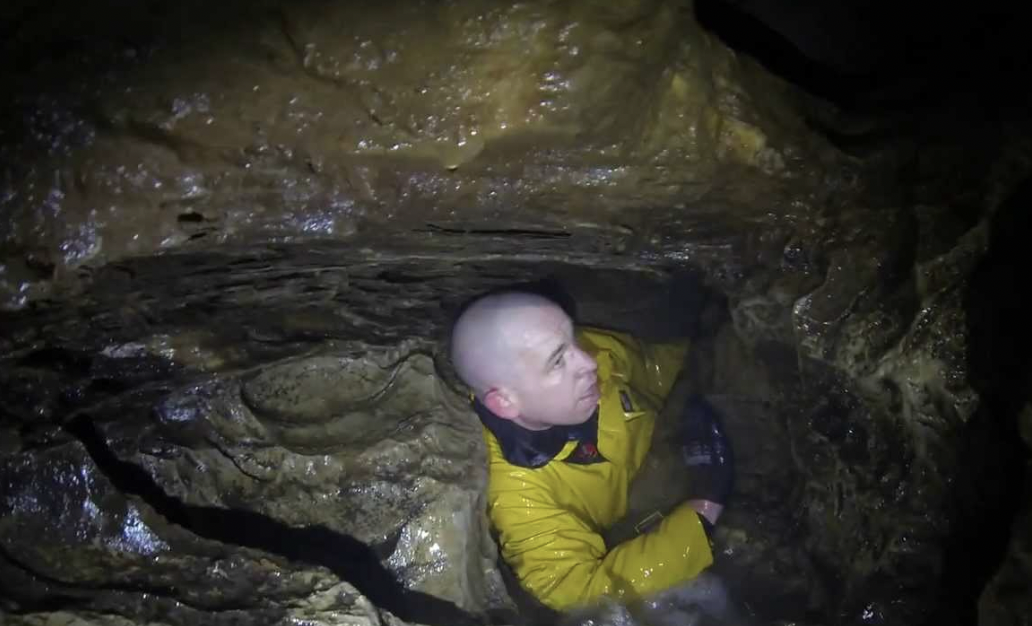 Man films himself while stuck in underground tunnel.