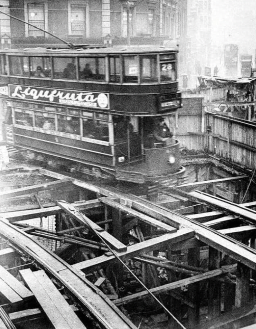 A tram passing over construction of the Piccadilly Line in London, 1903.