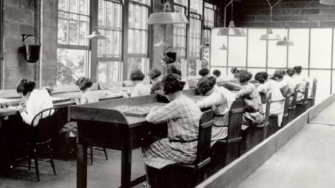 Employees of the U.S. Radium Corp. (Radium Girls), paint numbers on the faces of wristwatches using dangerous radioactive paint, 1922.