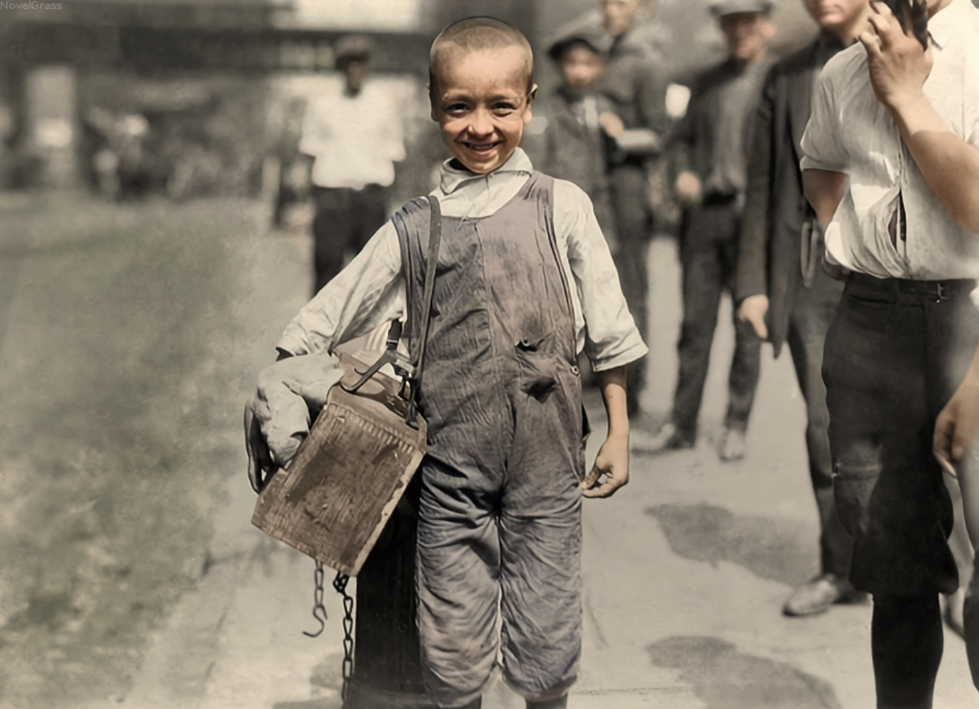 A child worker is happy to get his picture taken after a long day of work in NYC in 1924. A long day back then might have been up to 12 hours.